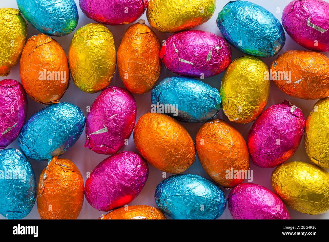 M&S choccy eggs, solid milk chocolate eggs - mini Easter Eggs ready for Easter - foiled solid milk chocolate mini eggs Stock Photo