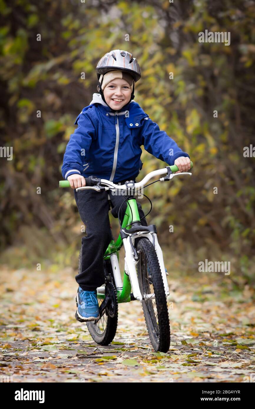 boy rides a bike in the park Stock Photo Alamy