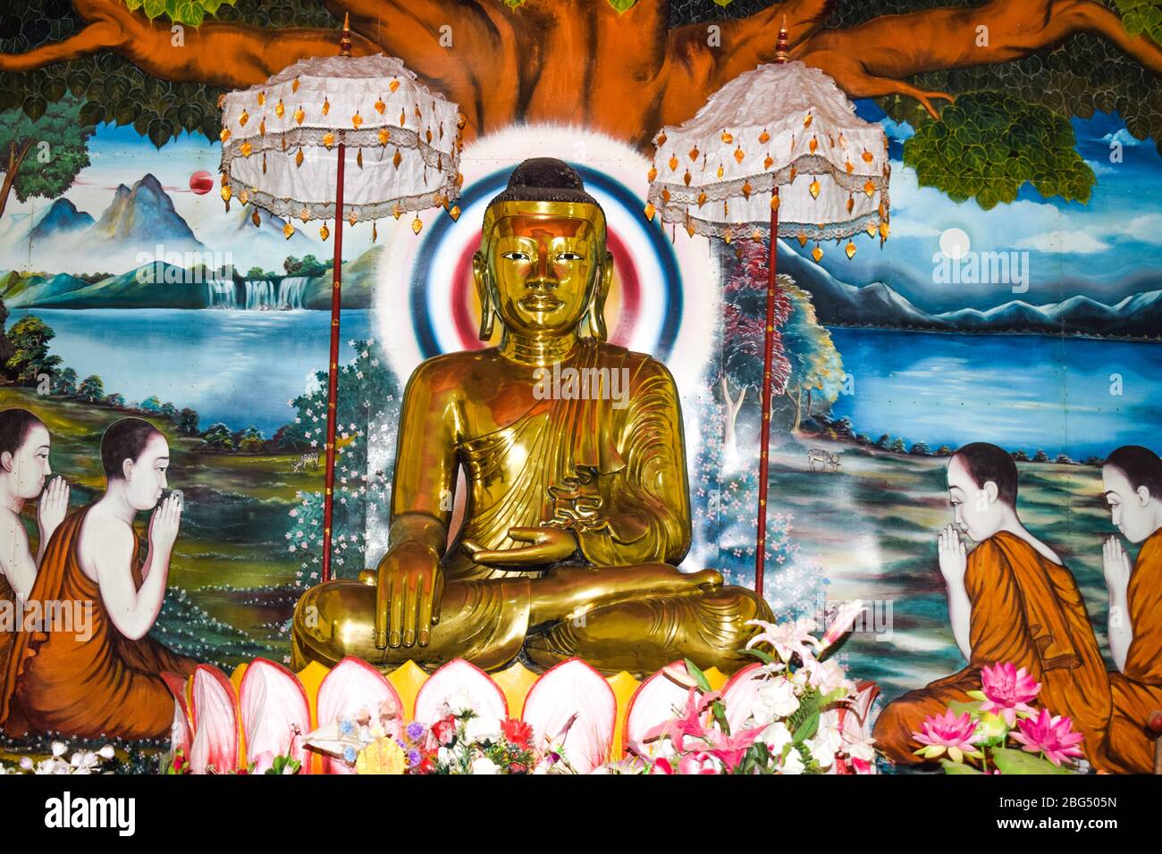 Statue made with real solid gold of gautama Buddha in a rural village for the worshipers Stock Photo