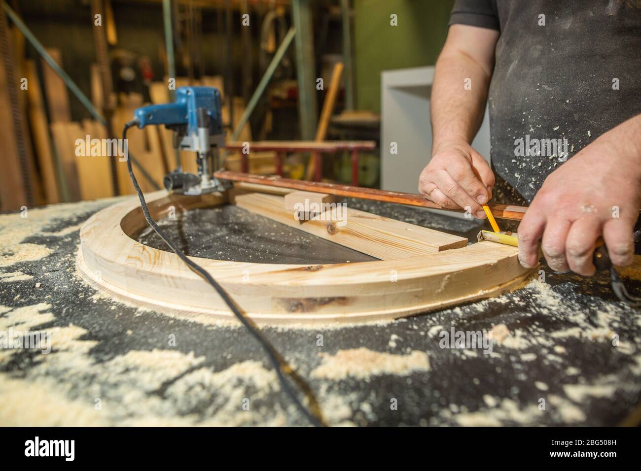 Joinery concept, woodworking and furniture making, carpenter work with wood in carpentry shop, industrial concept Stock Photo
