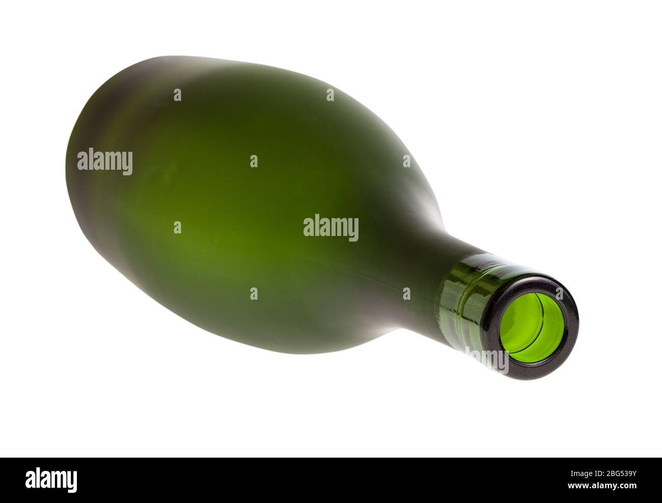 overturned empty green brandy bottle isolated on white background Stock Photo