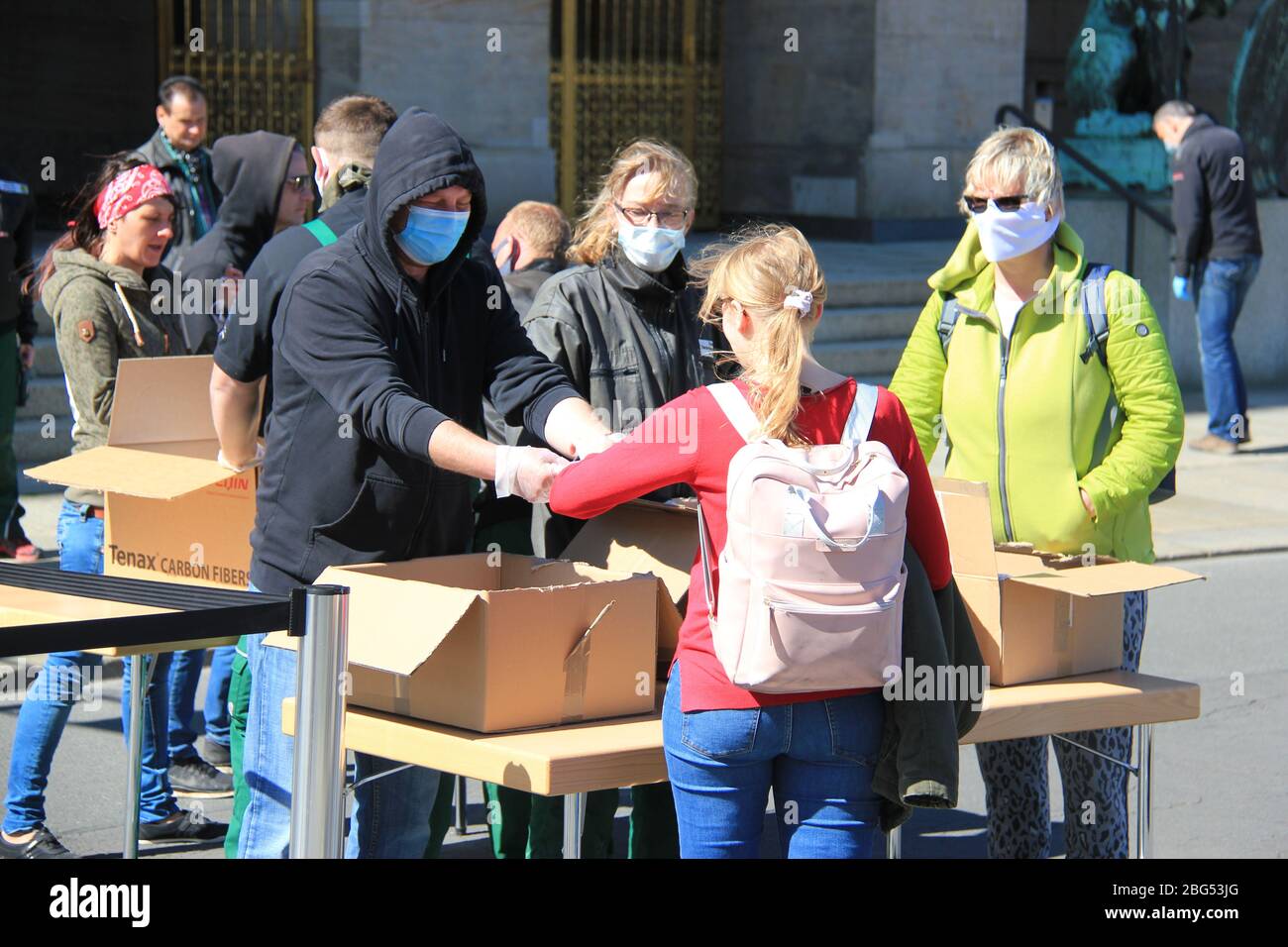 Drazdany, Germany. 20th Apr, 2020. City administration hand out face masks in Dresden, Germany, April 20, 2020. Saxony becomes first German state to make wearing a face mask mandatory. Starting at Monday, wearing a mouth and nose protection will be mandatory in shops, public transportation and supermarkets. Credit: Martin Weiser/CTK Photo/Alamy Live News Stock Photo