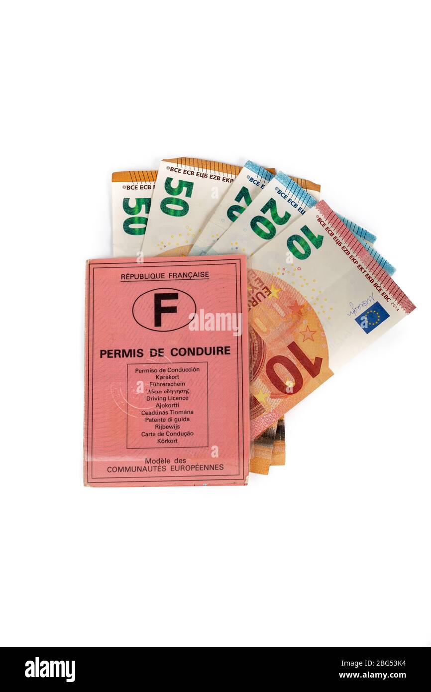 Paris, France - April 20, 2020 : French driving license valid in all European countries on white background and money. Concept : Driving license is ex Stock Photo