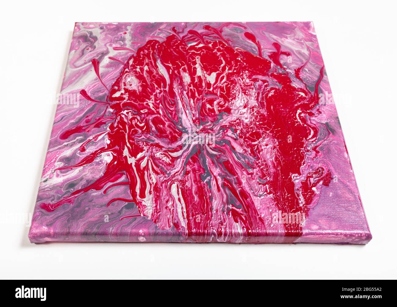 painting without frame with red blob and pink acrylic image on white background Stock Photo