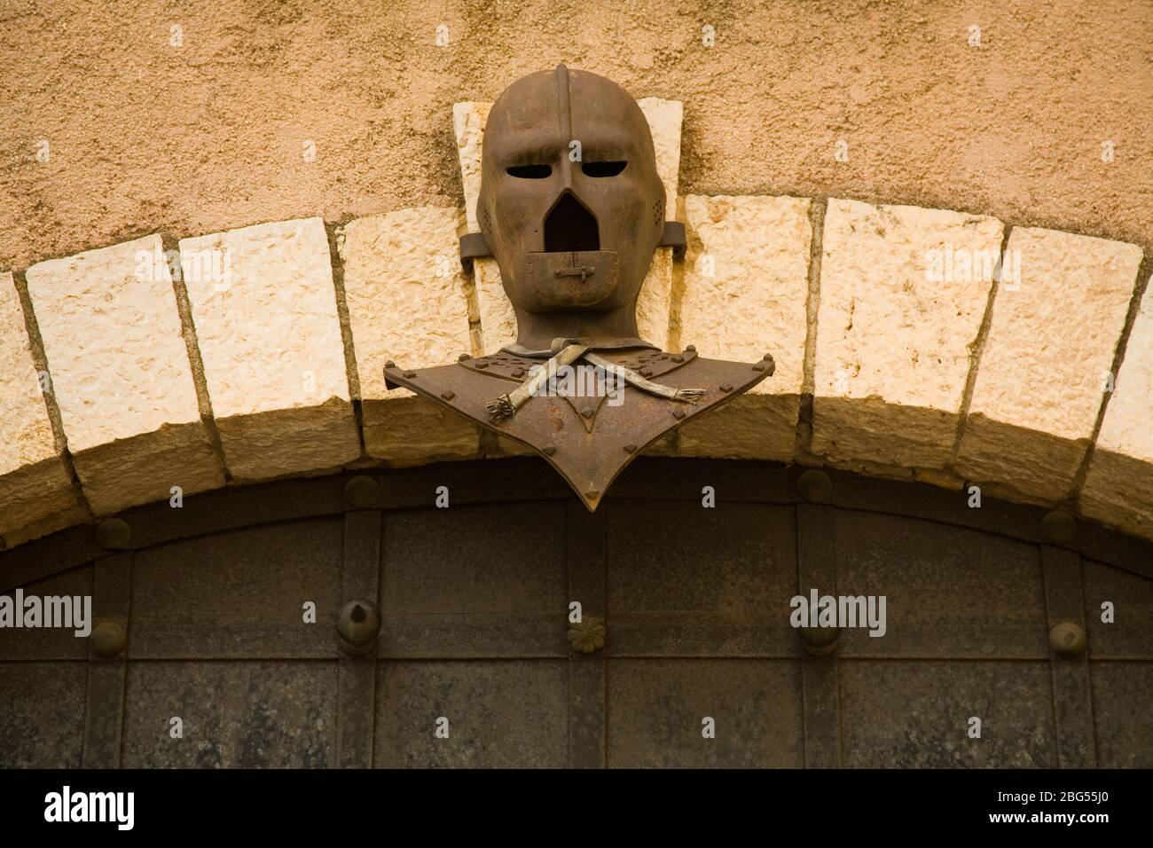 Iron Mask on old doorway, City of Cannes, France Stock Photo Alamy