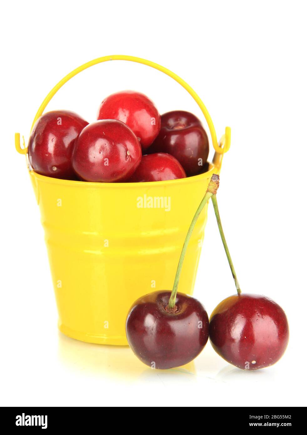 Cherry berries in bucket isolated on white Stock Photo Alamy