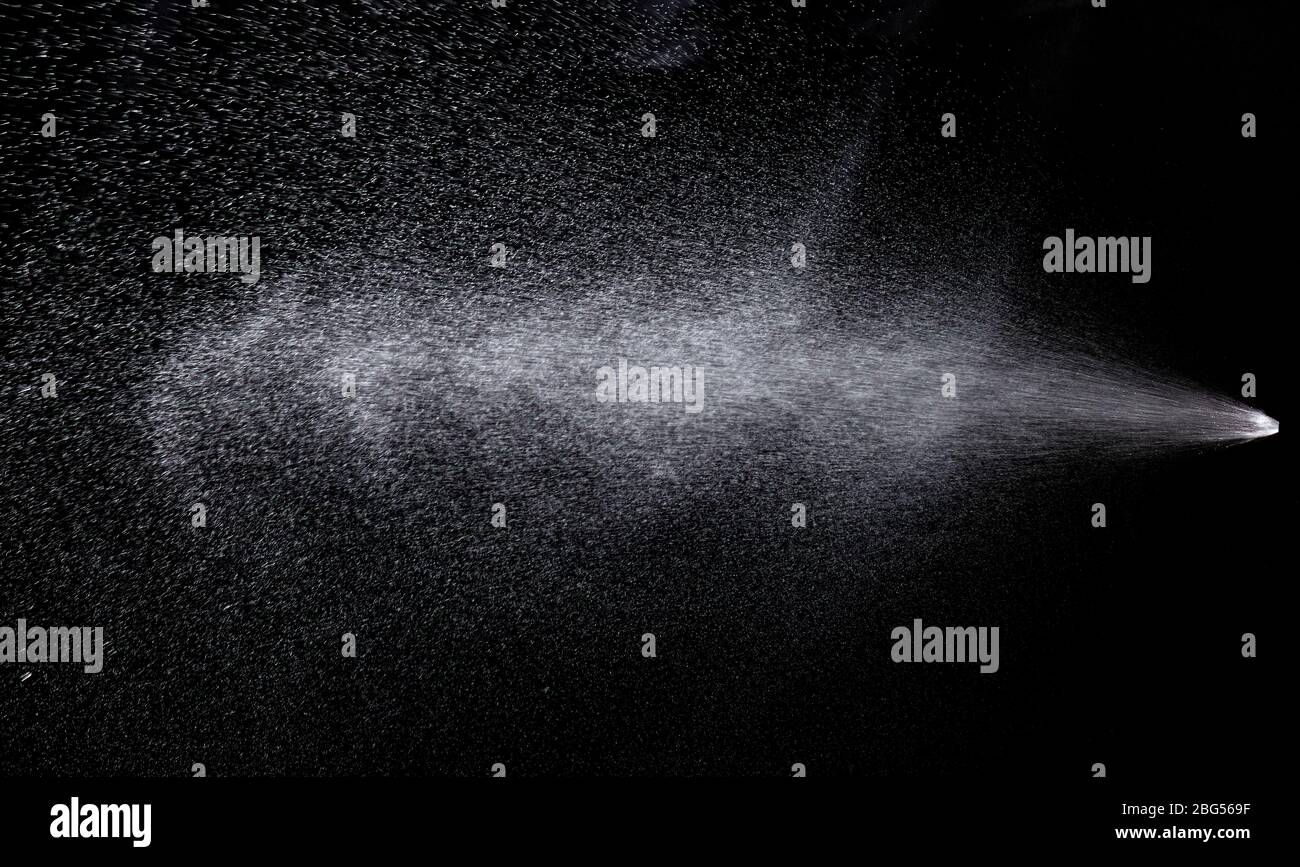 Spray aerosol on black background hi-res stock photography and images ...