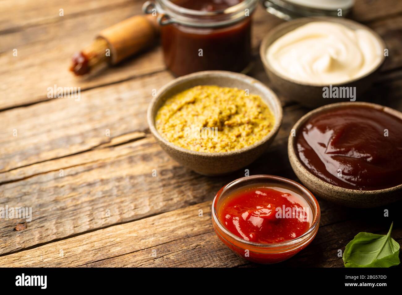 Classic set of sauces, American yellow mustard, ketchup, barbecue sauce