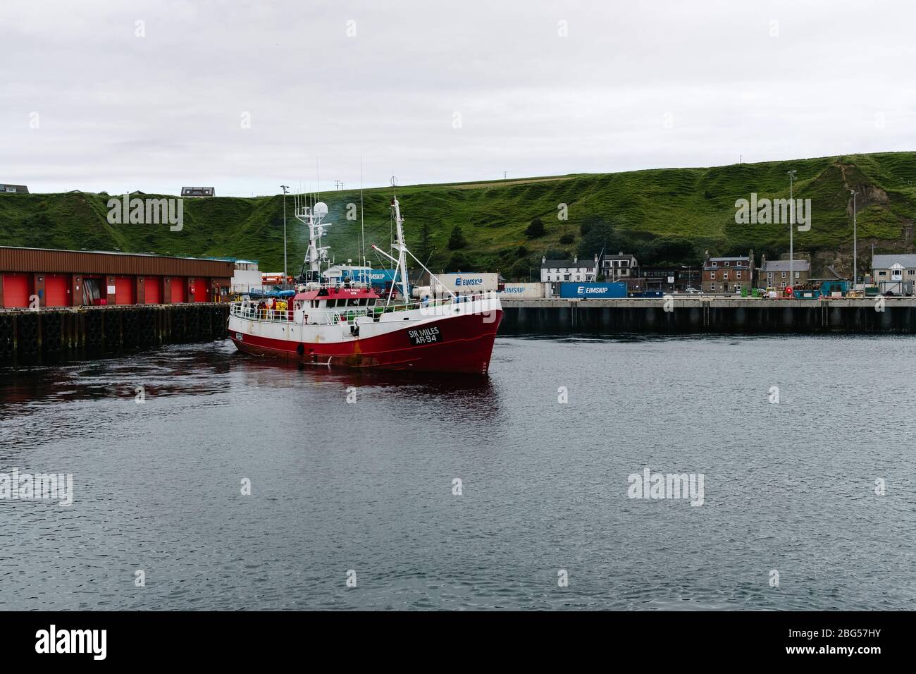 Ayr registered deep sea trawler the Sir Miles AR94 leaving Scrabster Harbour to fish in the North Sea. Stock Photo