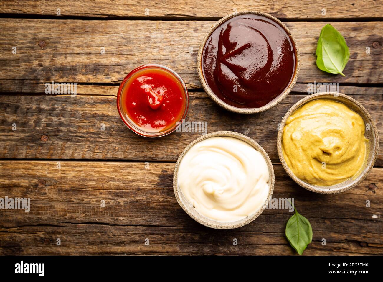 Classic set of sauces, American yellow mustard, ketchup, barbecue sauce