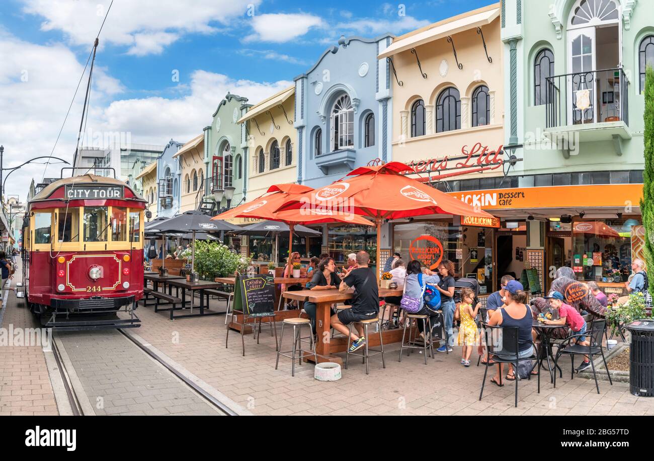 A Christchurch Tramway tram in front of cafes and bars on New Regent Street in the Central Business District, Christchurch, New Zealand Stock Photo