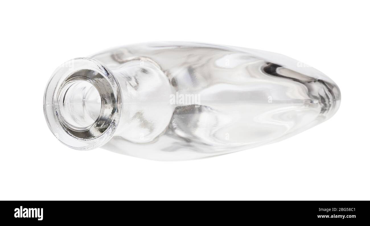 overturned empty clear cognac bottle isolated on white background Stock Photo