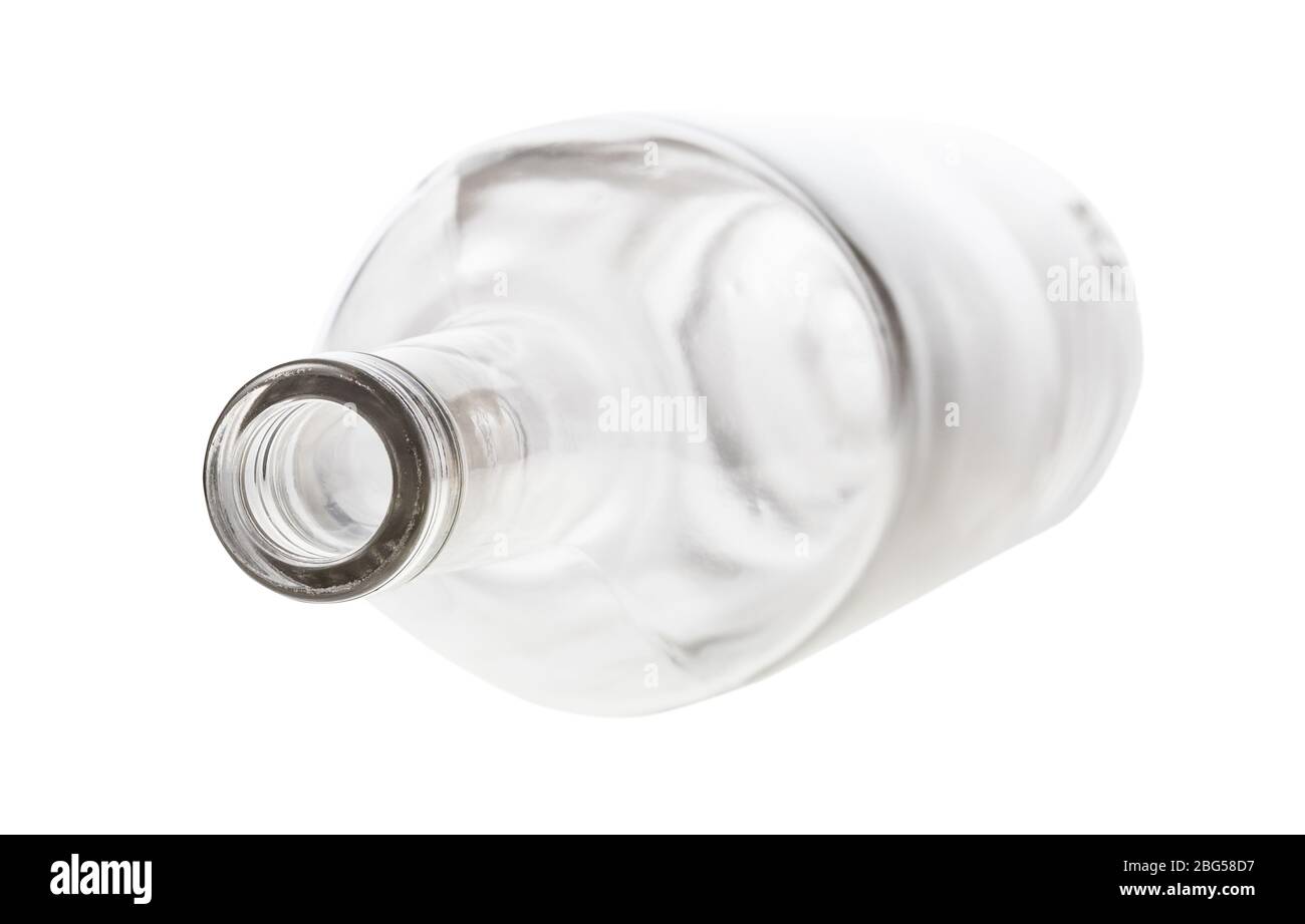 overturned empty clear bottle isolated on white background Stock Photo