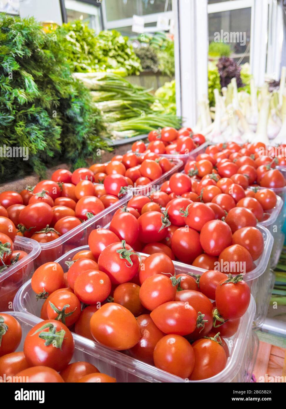 Fresh organic cherry tomatoes and greenery on the farmer market Stock ...