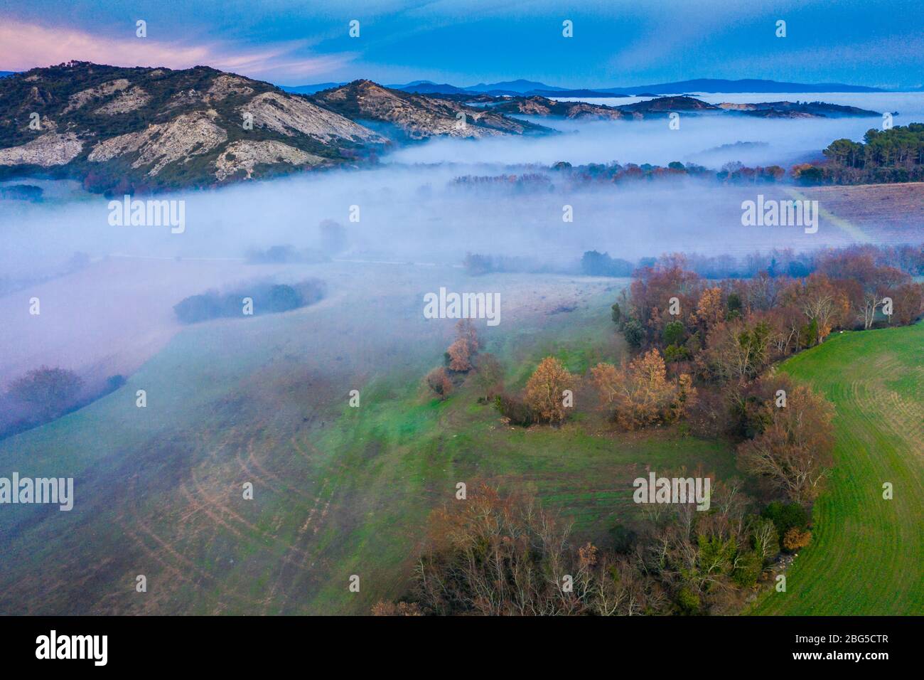Agricultural area and fog. Aerial view. Stock Photo