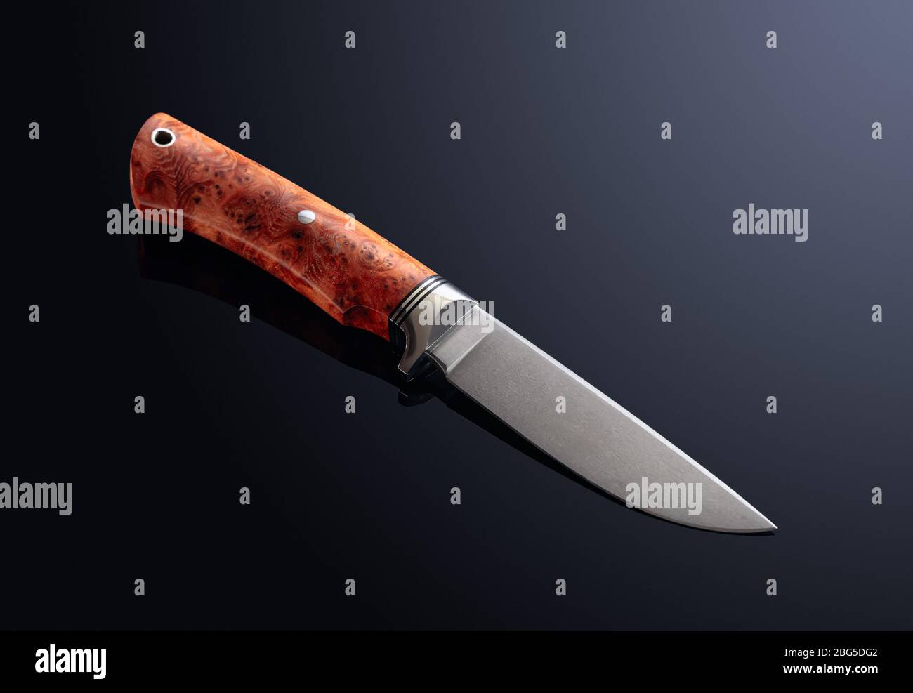 https://c8.alamy.com/comp/2BG5DG2/hunter-combat-hand-made-knife-on-dark-background-the-blade-has-a-beautiful-damask-pattern-handle-titan-and-elm-saved-clipping-path-2BG5DG2.jpg