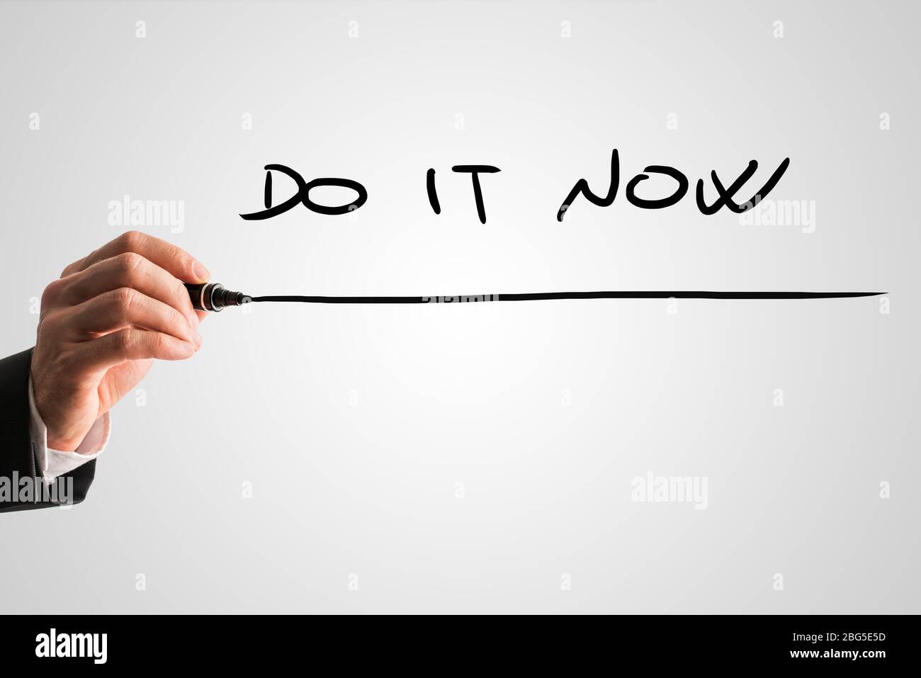Man writing business inspiration message Do it now on a virtual screen ...