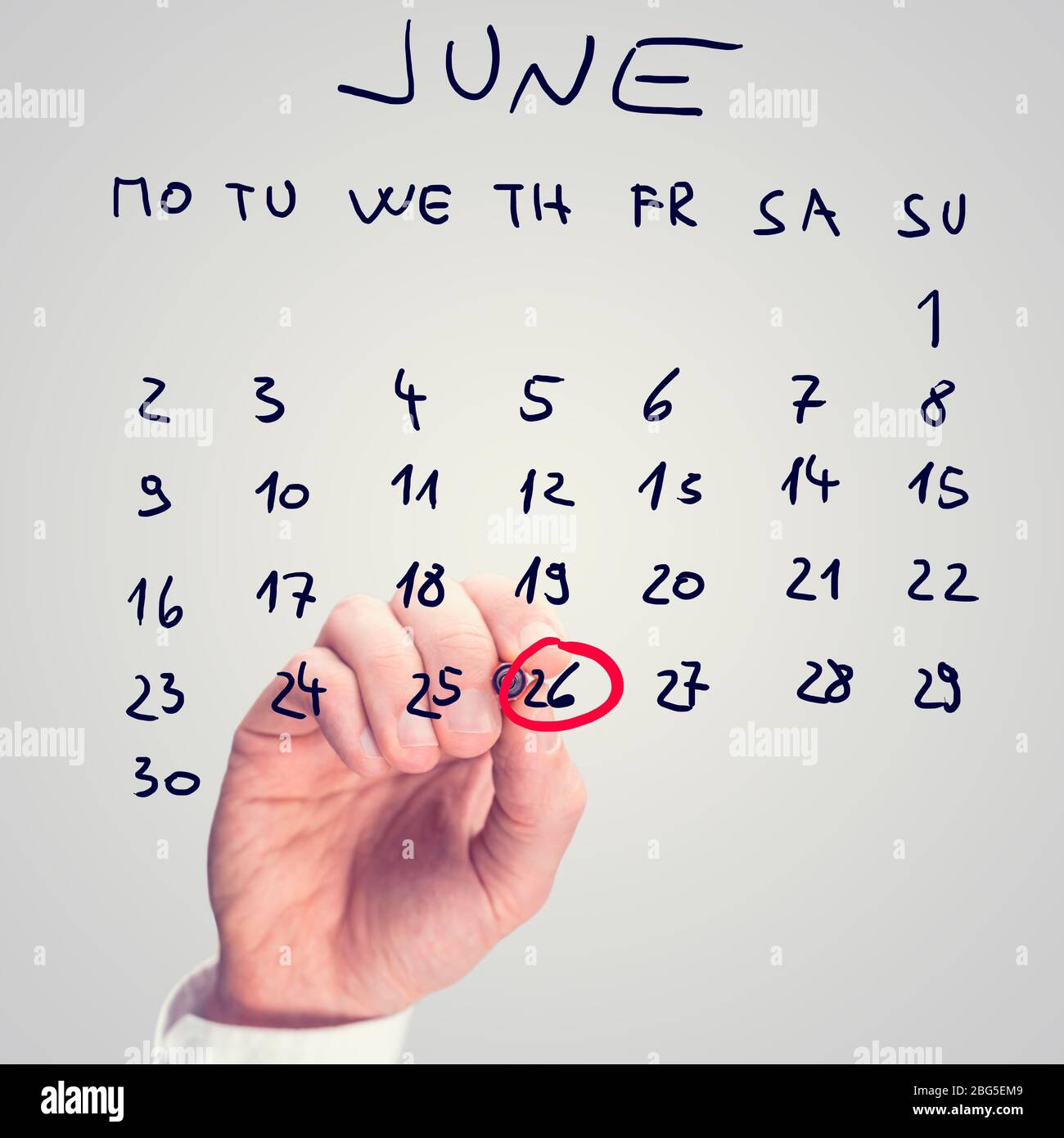 Male hand marking June 26th - International day against drug abuse and illicit trafficking - on virtual calendar. Stock Photo