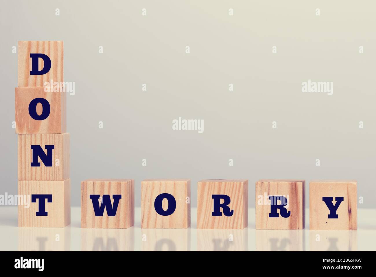 The inspirational words Dont Worry on wooden blocks arrange