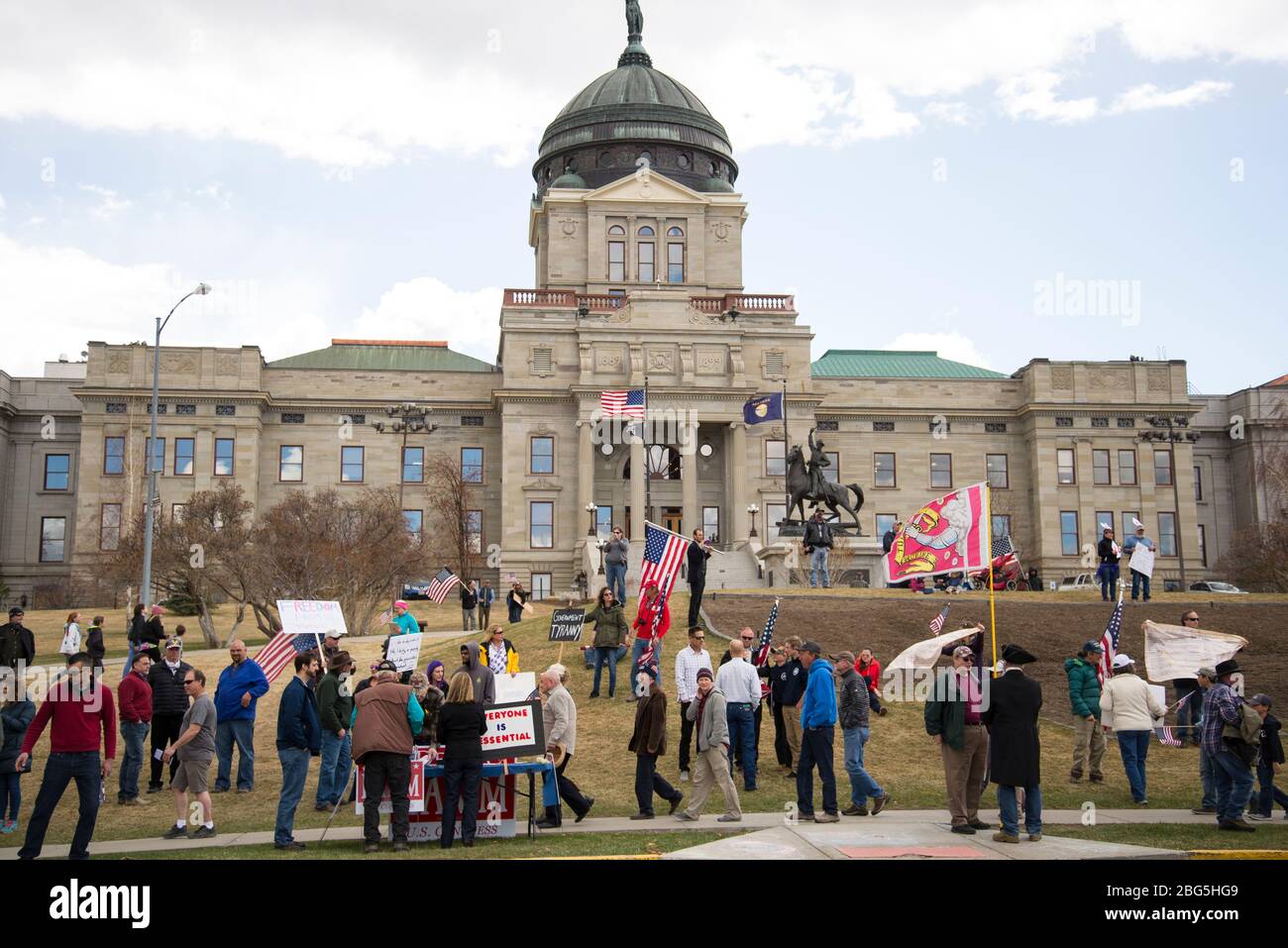 Helena, Montana - April 19, 2020: A crowd of demonstrators at the city Capitol protesting the governments shutdown over the Coronavirus unconstitution Stock Photo