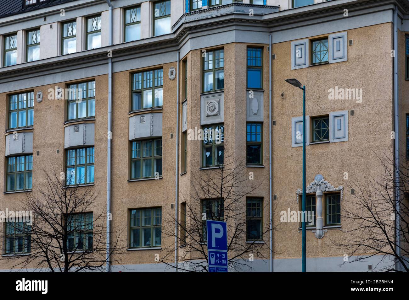 People in Finland are supporting each other in social distancing. 'Stay safe' is written in window downtown Helsinki. Stock Photo