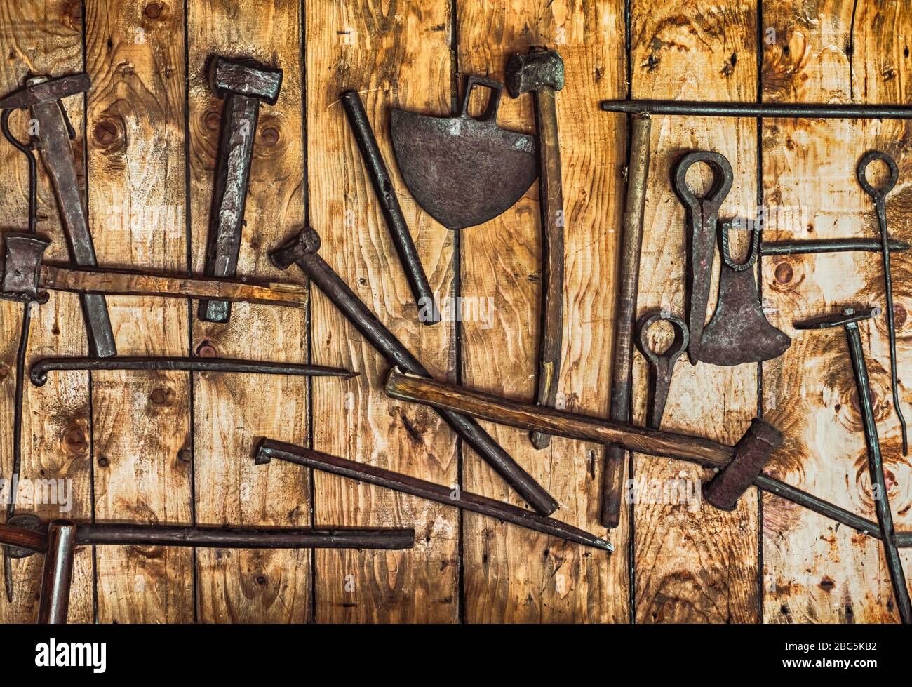 rudimentary gold mining tools hanging on a wall of planks Stock Photo -  Alamy