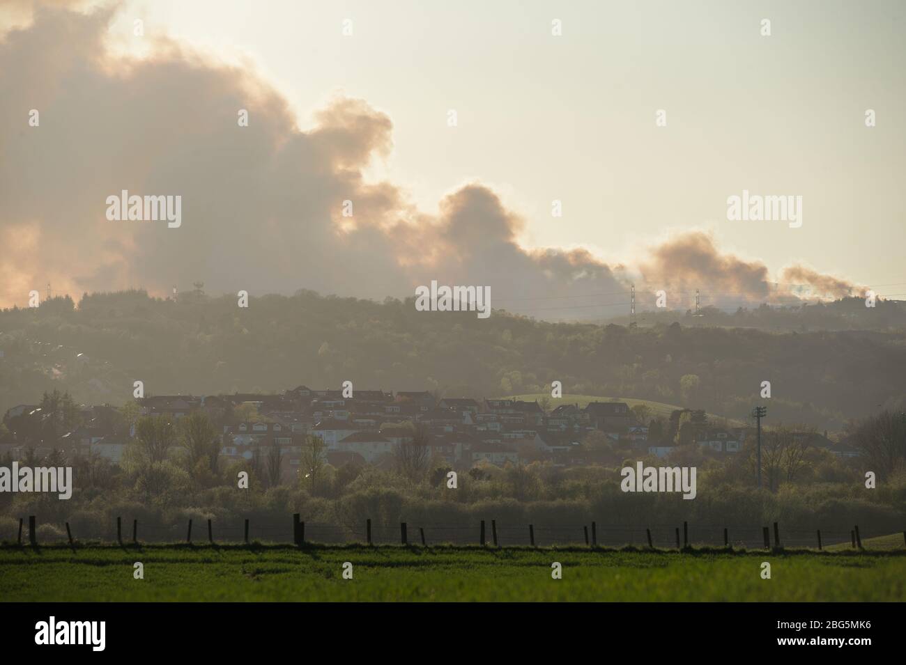 Milngavie, Glasgow, UK. 20th Apr, 2020. Pictured: Huge plumes of dark smoke billow form a massive wildfire which looks like its out of control, burns over the Kilpatrick hills in Glasgow. Credit: Colin Fisher/Alamy Live News Stock Photo