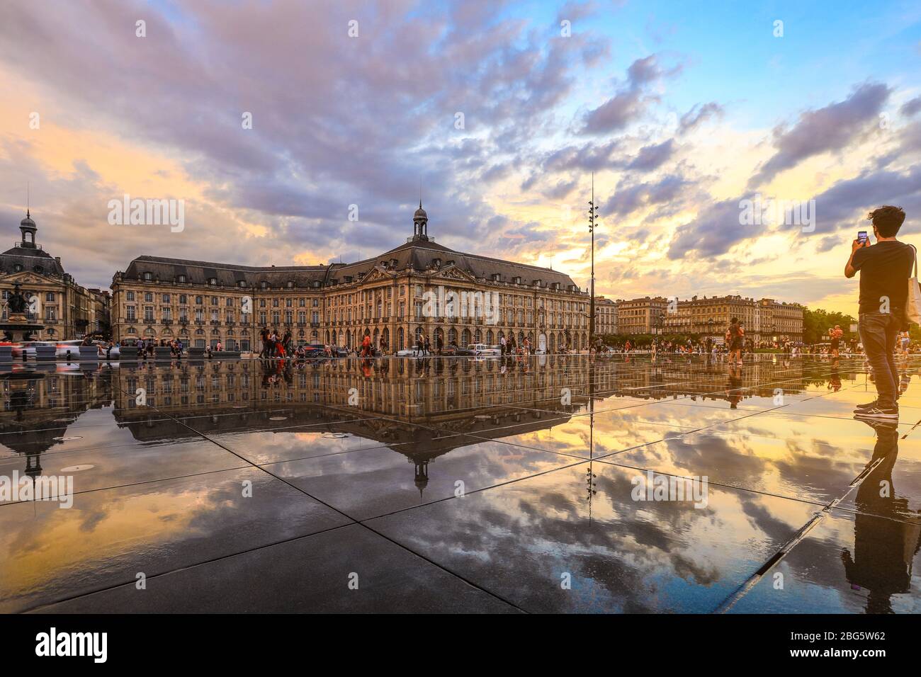 Bordeaux, France - 3 September, 2018 : Reflection of Place De La Bourse and tram in Bordeaux, France. A Unesco World Heritage Stock Photo