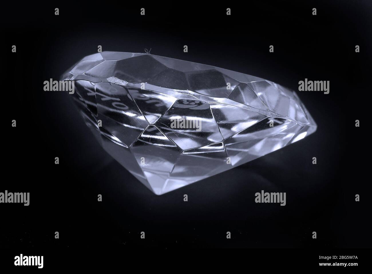 Large sparkling diamond isolated on black background Stock Photo - Alamy