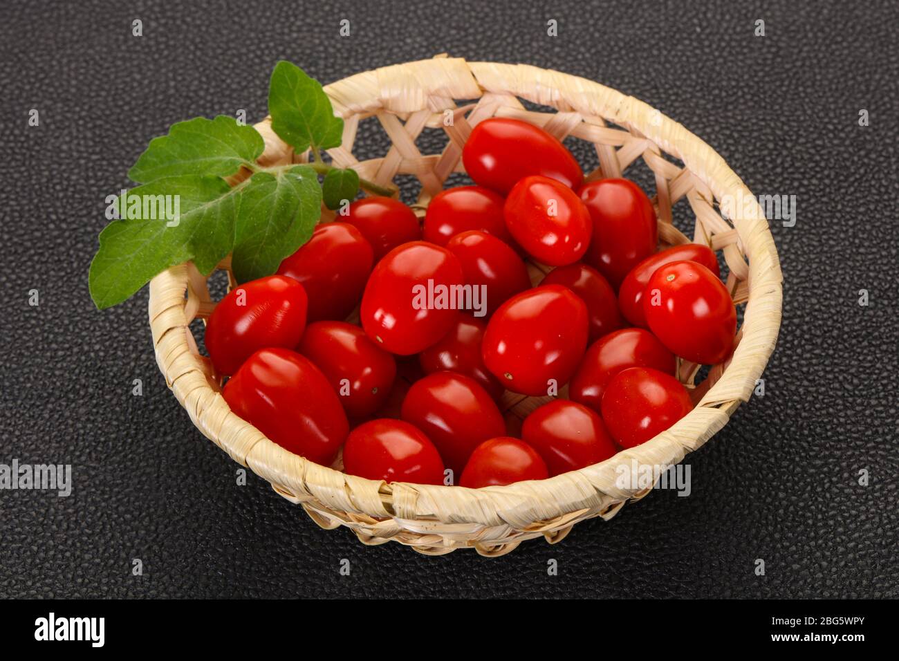 Sweet Red cherry tomatoes in the bowl Stock Photo - Alamy