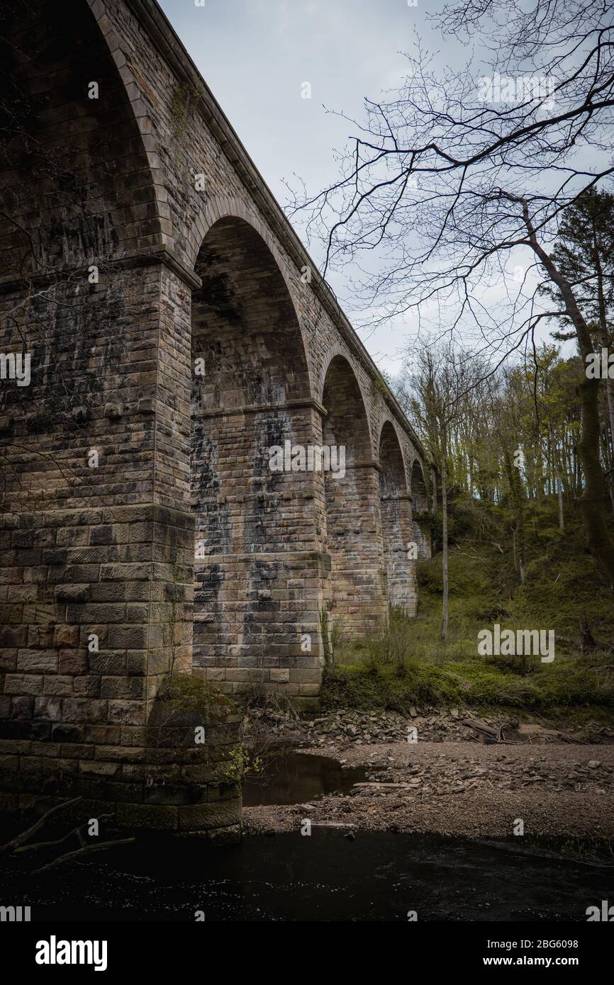An old stone built British viaduct in the Yorkshire countryside Stock Photo