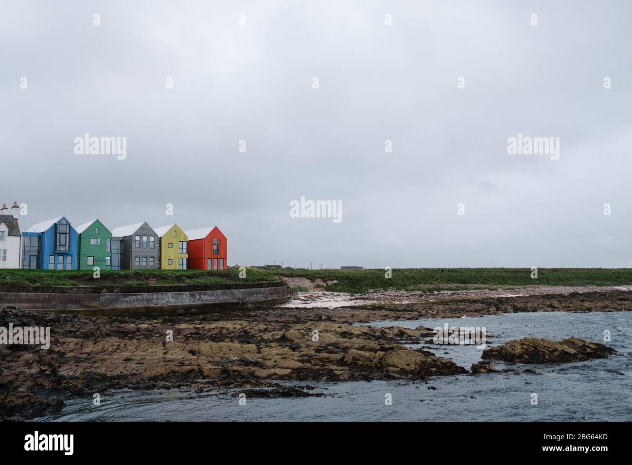 The Inn at John O' Groats, which has been recently extended with these colourful norse style houses which suit the location. Stock Photo