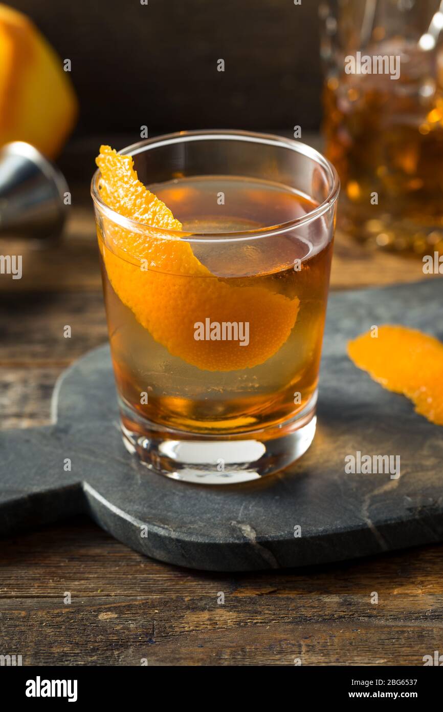 Refreshing Bourbon Old Fashioned Cocktail with Round Ice Cube Stock
