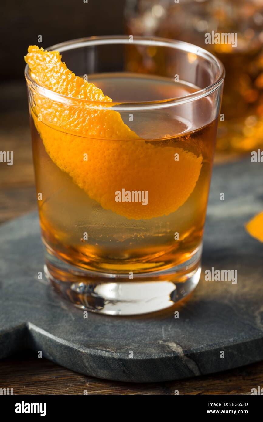 https://c8.alamy.com/comp/2BG653D/refreshing-bourbon-old-fashioned-cocktail-with-round-ice-cube-2BG653D.jpg
