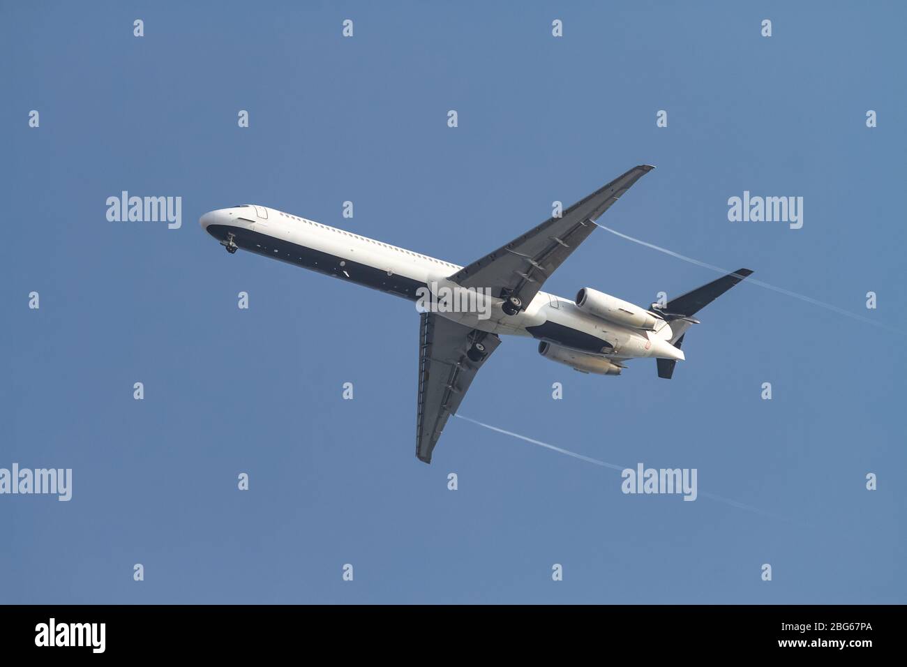 Passenger Airplane in the Sky with Blue Background Stock Photo - Alamy
