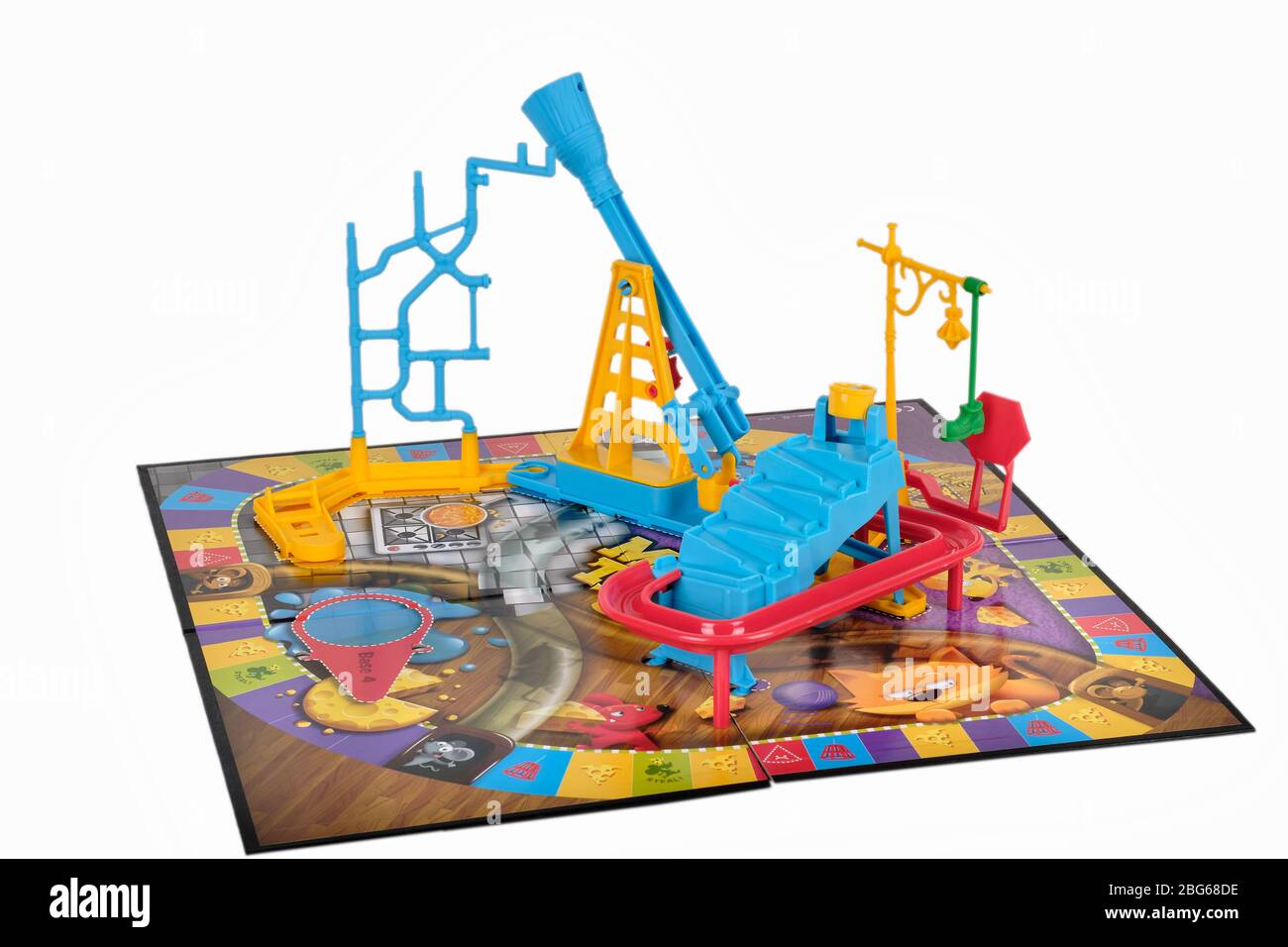 Close up of Hasbro Mouse trap board game pieces being assembled onto the board Stock Photo