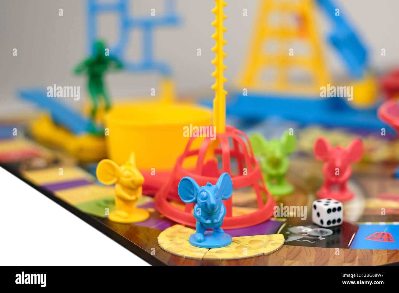 Close up of assembled Hasbro Mouse trap board game with one mouse at bottom of cage pole and view of cage other mice diver wash tub cheese pieces and Stock Photo