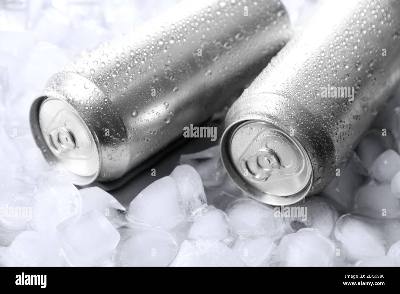 Metal cans of beer with ice cubes, close up Stock Photo Alamy