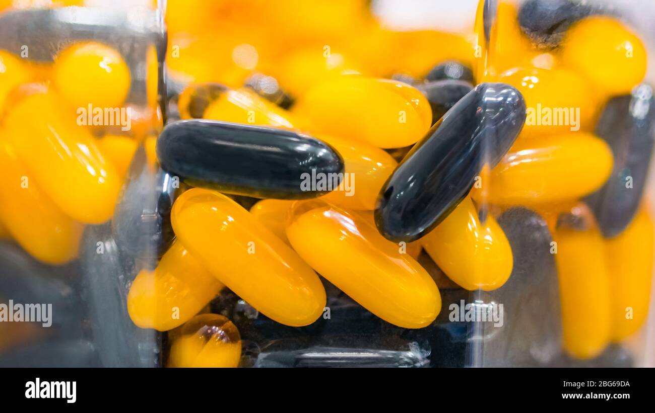 Supplements and pills in glass jar for sale at pharmacy drug store Stock Photo