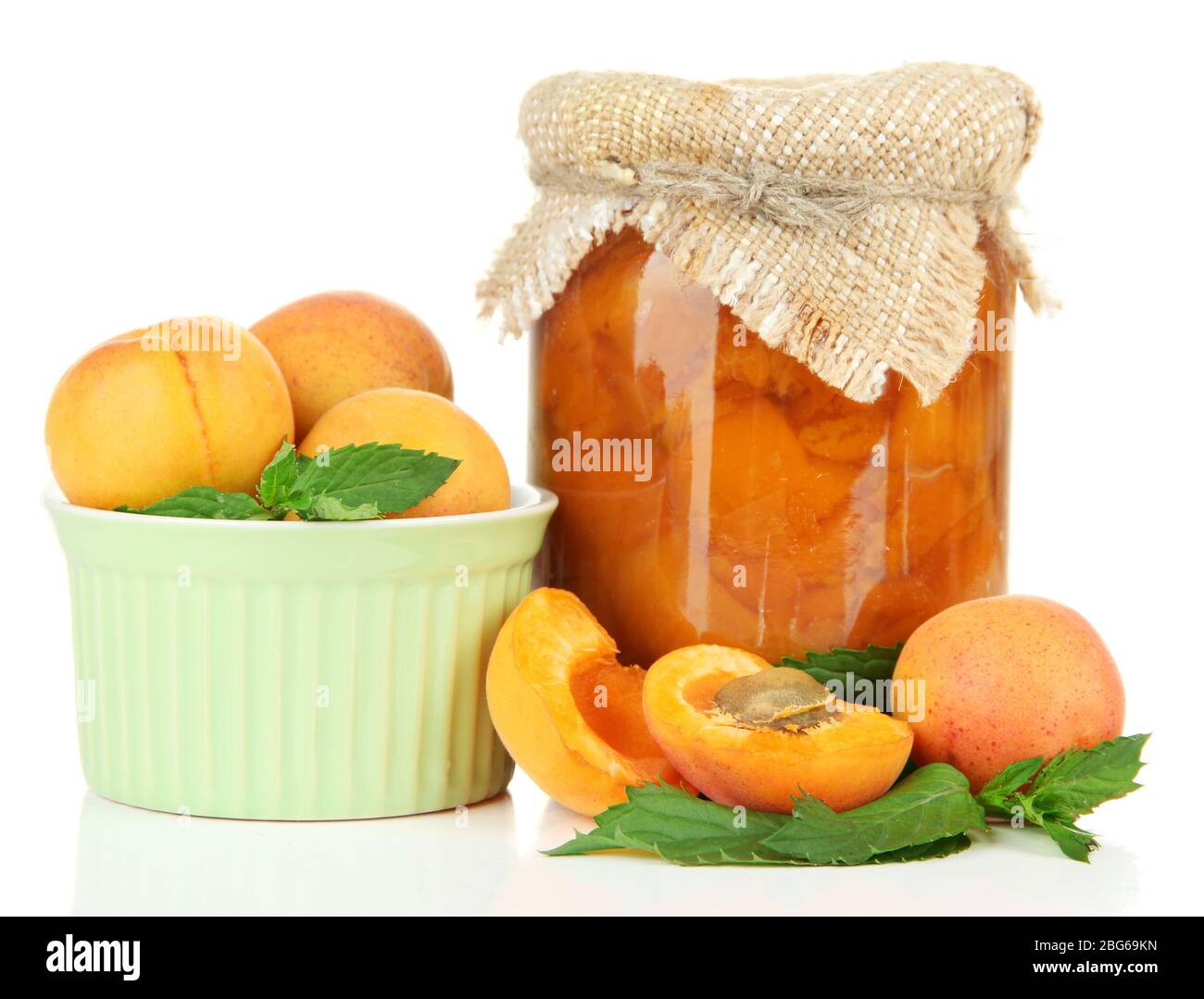 Apricot jam in glass jar and fresh apricots, isolated on white Stock ...
