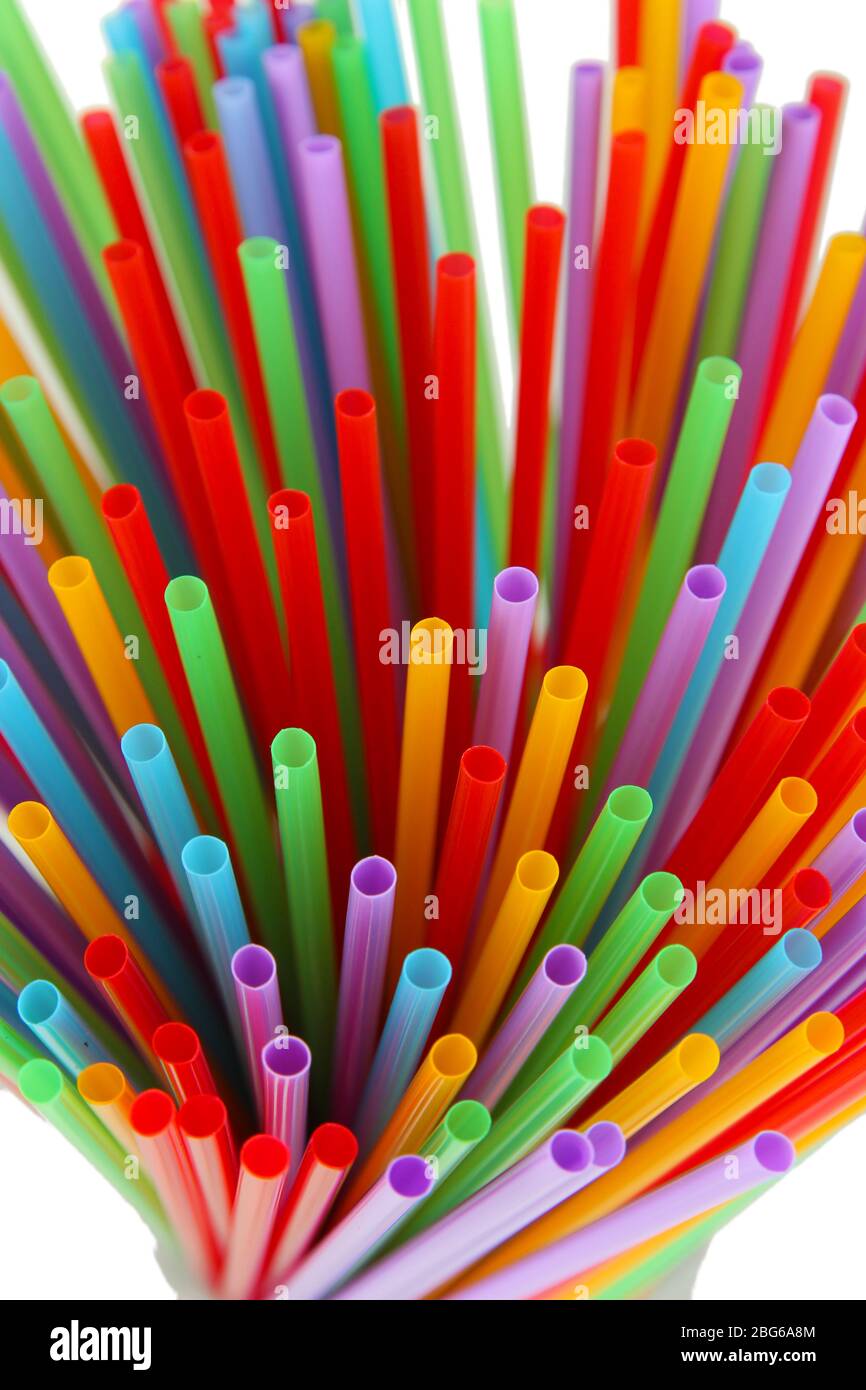 Many straws close-up isolated on white Stock Photo - Alamy
