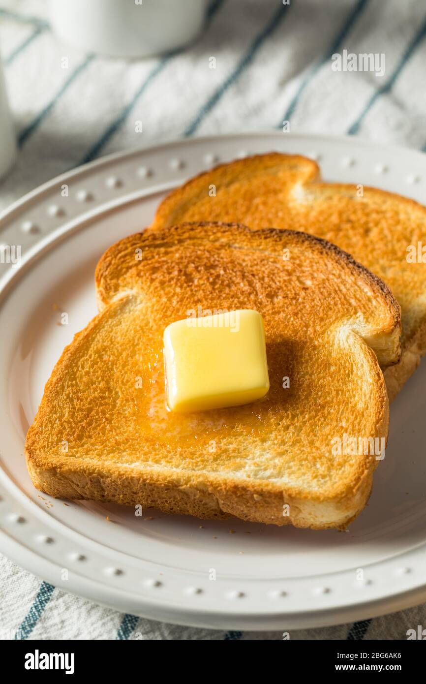 Homemade Warm Buttered Toast for Breakfast on a Plate Stock Photo Alamy