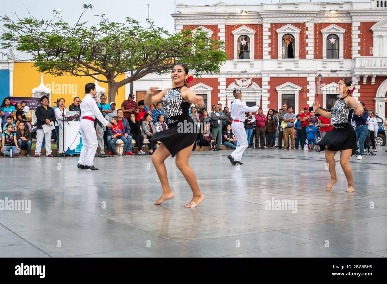 Dancers in costume performing Festejo traditional AfroPeruvian dance