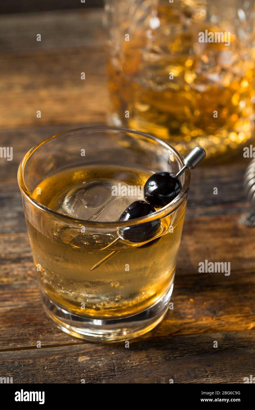 Boozy Bourbon Old Fashioned with Maraschino Cherries and Sphere Ice