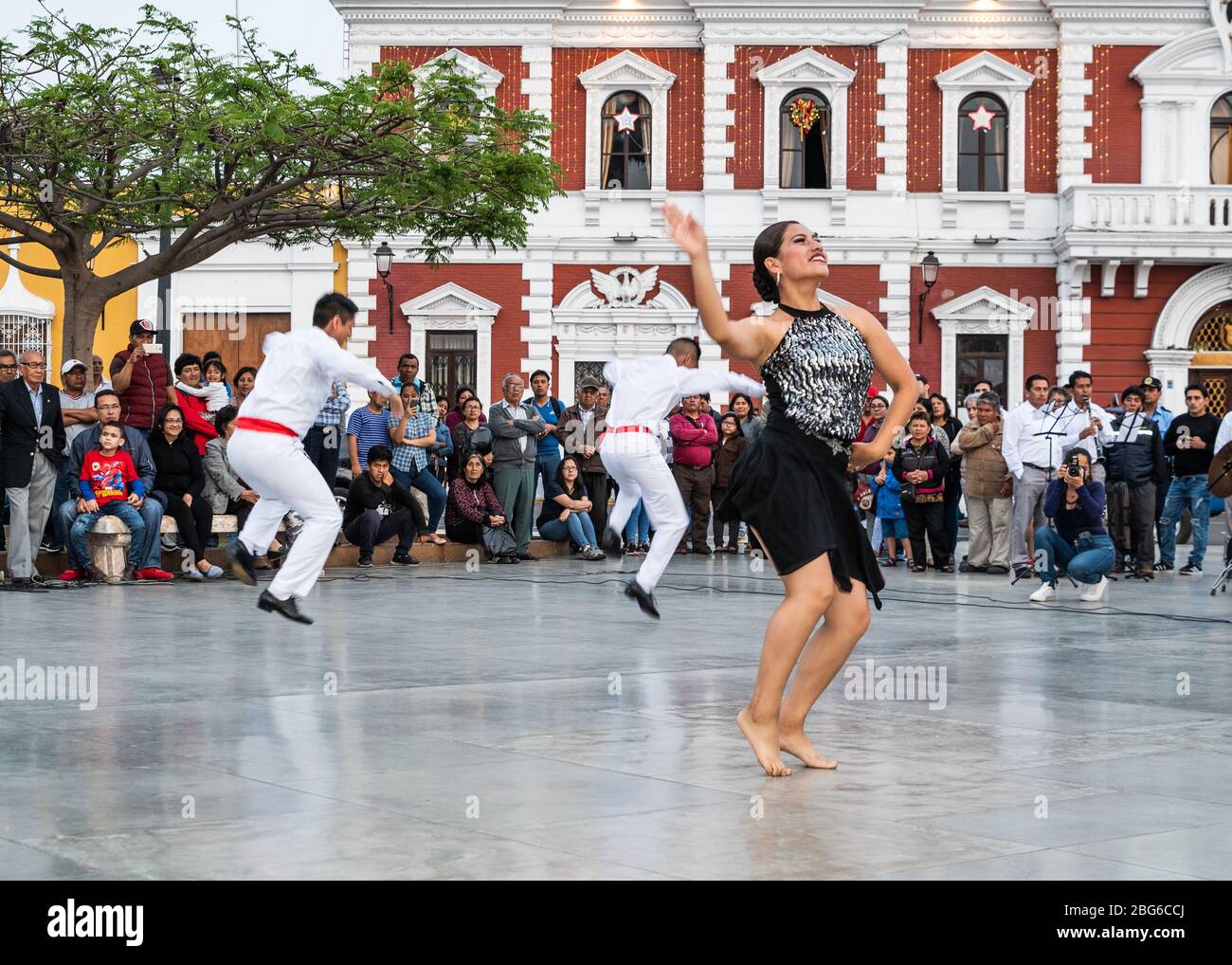 Dancers in costume performing Festejo traditional AfroPeruvian dance
