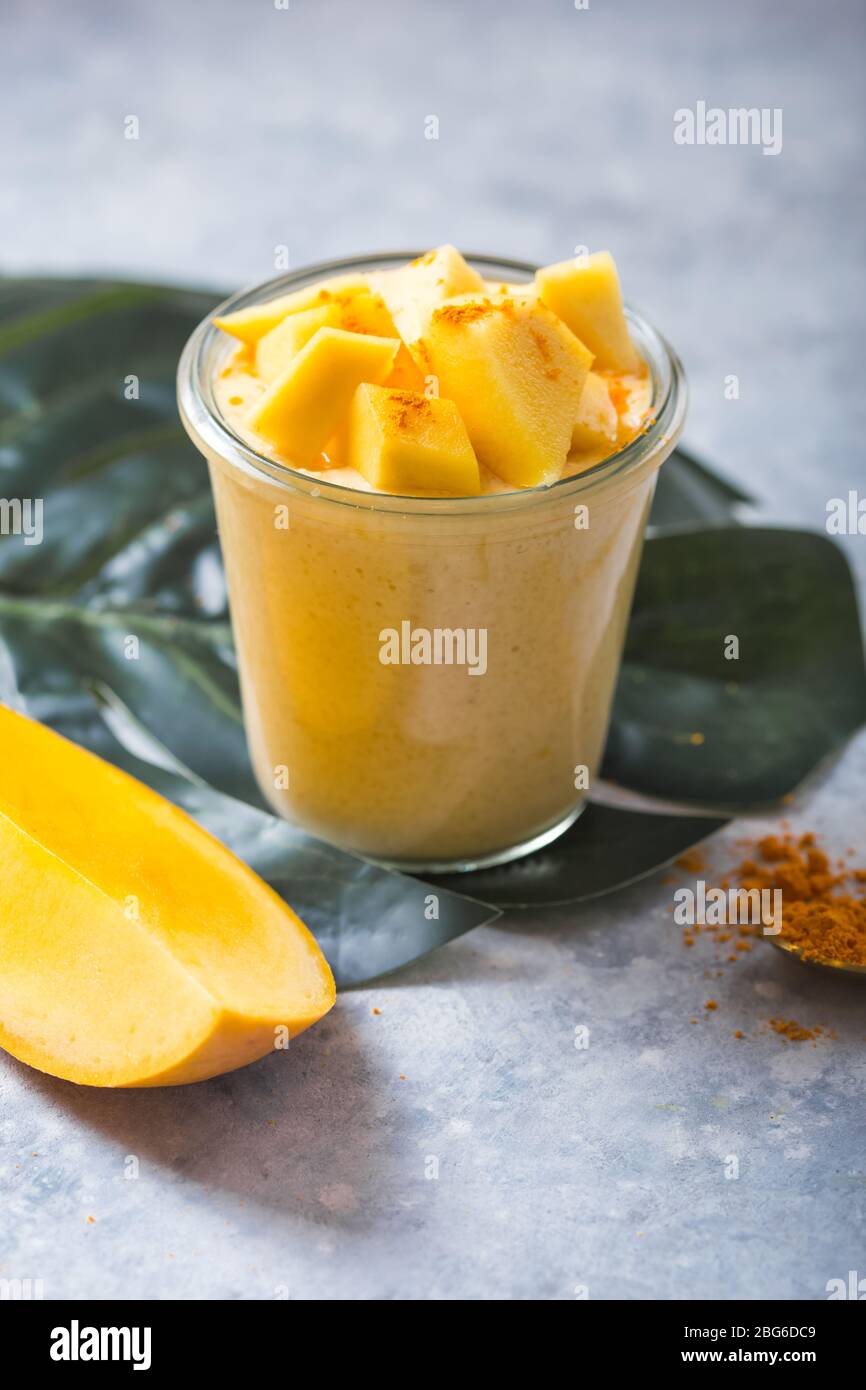 yellow mango yogurt or smoothie on grey background turmeric lassie or lassi in glass stock photo alamy https www alamy com yellow mango yogurt or smoothie on grey background turmeric lassie or lassi in glass image354184105 html