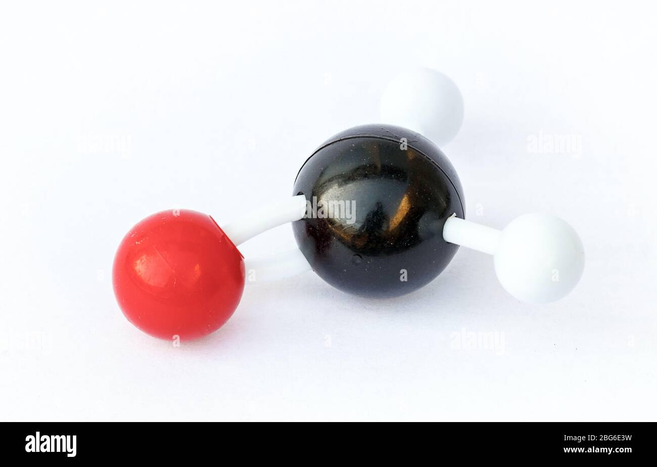 Plastic ball-and-stick model of a formaldehyde (chemical formula CH2O) molecule on a white background. Stock Photo