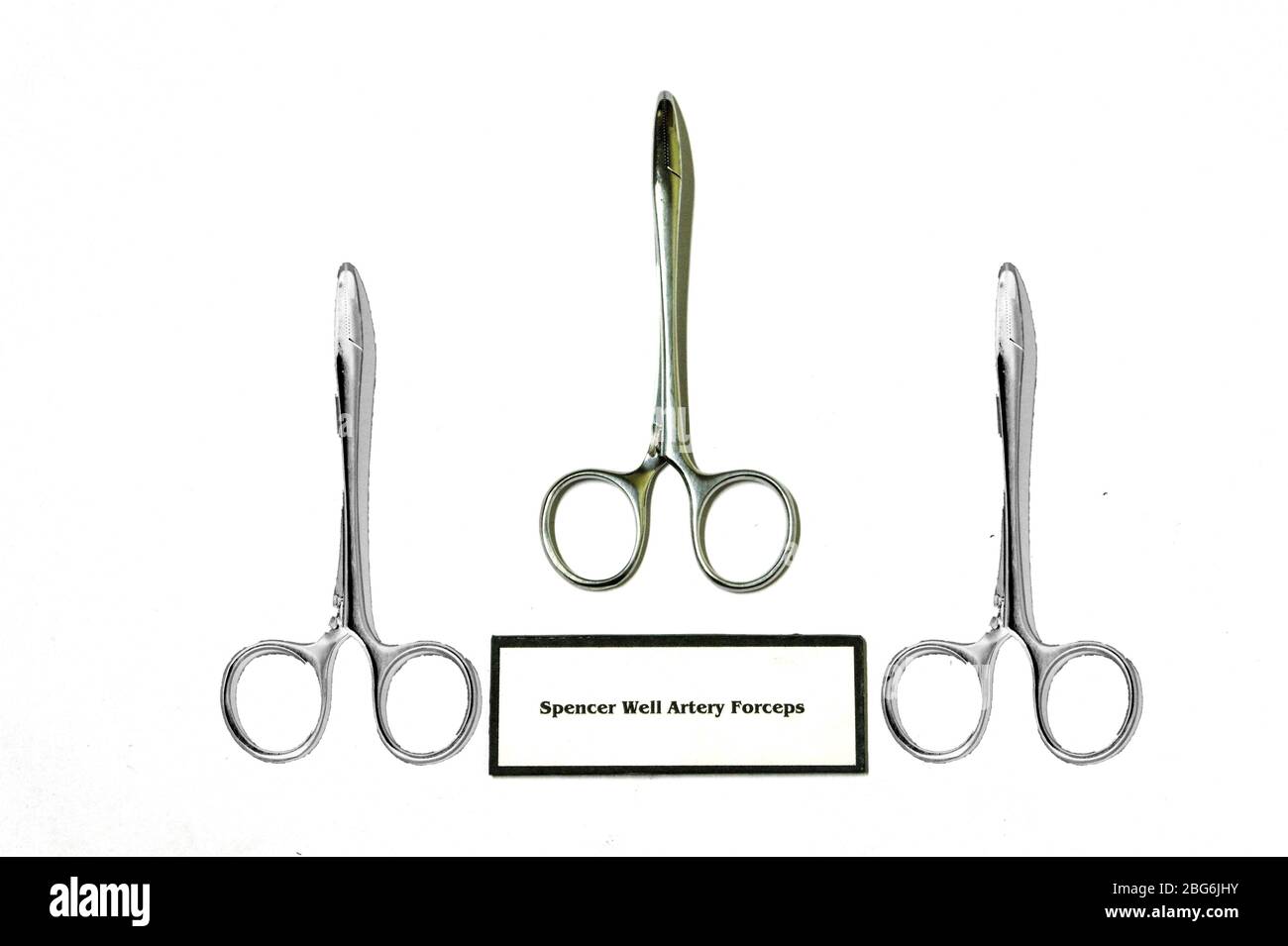 A trio of vintage Spencer Well Artery Forceps, named after their inventor, and used in surgery to prevent arteries and tissues being entangled. Stock Photo