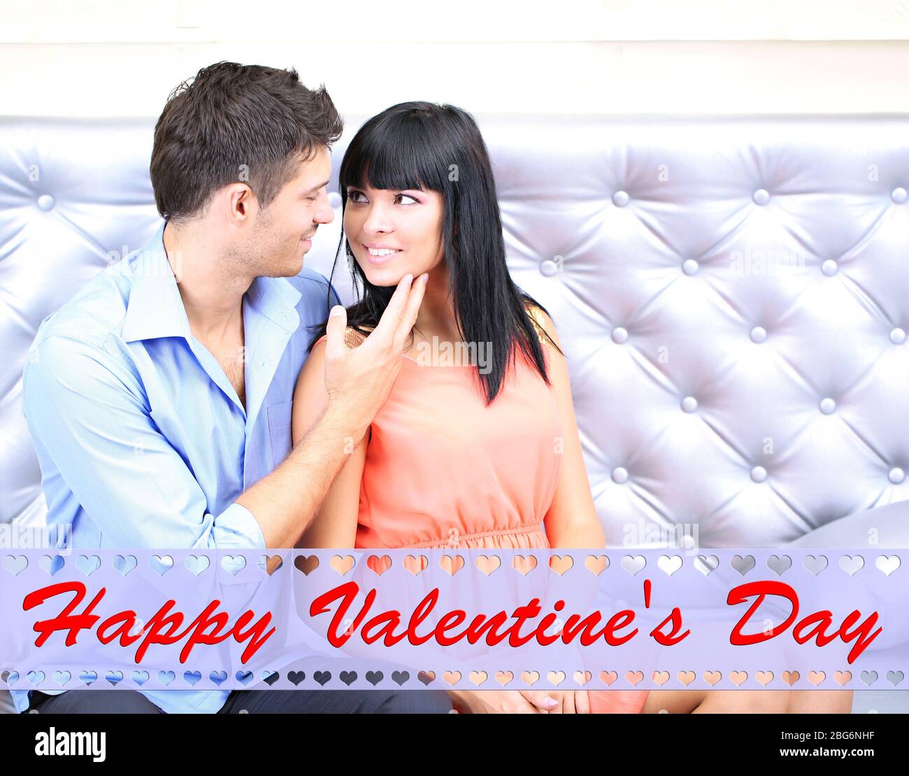 Amorous couple sitting on sofa hi-res stock photography and images - Alamy