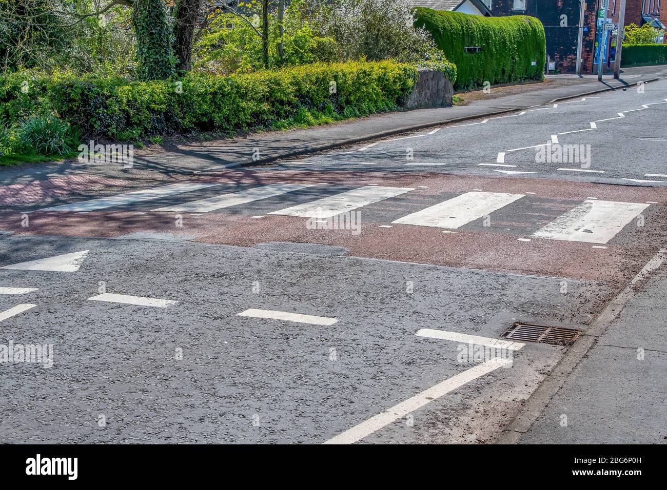 A Raised Zebra crossing in the UK which alco acts sa a speed hump Stock